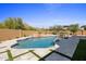 Inviting pool area with desert landscape and stone accents, perfect for relaxation and outdoor enjoyment at 25838 N 104Th Pl, Scottsdale, AZ 85255