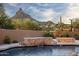 Resort-style pool with water feature and mountain backdrop at 25838 N 104Th Pl, Scottsdale, AZ 85255