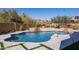 Luxury pool with a waterfall feature and mountain views at 25838 N 104Th Pl, Scottsdale, AZ 85255