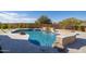 Inviting pool with a waterfall, fire pit, and ample patio space at 25838 N 104Th Pl, Scottsdale, AZ 85255