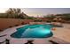 Beautiful backyard pool surrounded by desert landscaping and mountain views, perfect for relaxation and entertaining at 25838 N 104Th Pl, Scottsdale, AZ 85255