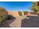 Backyard with gravel ground cover and block wall at 26430 S Pinewood Dr, Sun Lakes, AZ 85248