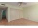 Bedroom with wood-look floors and mirrored closet doors at 26430 S Pinewood Dr, Sun Lakes, AZ 85248