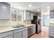 Kitchen features stainless steel appliances and double sink at 26430 S Pinewood Dr, Sun Lakes, AZ 85248