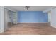 Bright living room with light blue walls and wood-look floors at 26430 S Pinewood Dr, Sun Lakes, AZ 85248