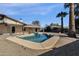 Inviting backyard with refreshing blue pool, ample patio space, and desert landscaping at 2647 E Evergreen St, Mesa, AZ 85213