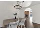 Light and airy dining room with a wooden table and white chairs at 2647 E Evergreen St, Mesa, AZ 85213