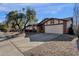 Charming single story home with a large front yard and driveway at 2647 E Evergreen St, Mesa, AZ 85213