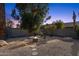 Charming fire pit area perfect for outdoor gatherings, surrounded by desert landscaping at 2647 E Evergreen St, Mesa, AZ 85213