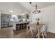 Modern kitchen with gray cabinets, quartz countertops, and island at 2647 E Evergreen St, Mesa, AZ 85213