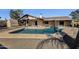 Spacious backyard with refreshing pool and storage shed at 2647 E Evergreen St, Mesa, AZ 85213