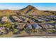 Aerial view of neighborhood with mountain backdrop at 27648 N 102Nd Ln, Peoria, AZ 85383