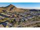 Aerial view of neighborhood with mountain backdrop at 27648 N 102Nd Ln, Peoria, AZ 85383