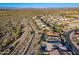 Aerial view of home with solar panels, pool, and desert landscape at 27648 N 102Nd Ln, Peoria, AZ 85383