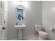 Clean and simple powder room with pedestal sink at 27648 N 102Nd Ln, Peoria, AZ 85383