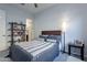 Charming bedroom with a full-size bed and built-in shelving at 27648 N 102Nd Ln, Peoria, AZ 85383