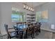 Bright dining room with a farmhouse table and view to backyard at 27648 N 102Nd Ln, Peoria, AZ 85383