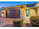 Night view of the home's exterior and landscaping at 27648 N 102Nd Ln, Peoria, AZ 85383