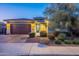 Stunning curb appeal with desert landscaping and 3-car garage at 27648 N 102Nd Ln, Peoria, AZ 85383