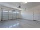 Garage with overhead storage and epoxy flooring at 27648 N 102Nd Ln, Peoria, AZ 85383