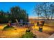 Landscaped patio with seating area and fire pit, perfect for outdoor entertaining at 27648 N 102Nd Ln, Peoria, AZ 85383