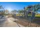 Traditional playground with a slide and playhouse at 27648 N 102Nd Ln, Peoria, AZ 85383