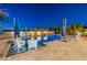 Relaxing pool and patio area with white lounge chairs at 27648 N 102Nd Ln, Peoria, AZ 85383