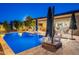 Stunning pool and patio area with plenty of space for relaxation at 27648 N 102Nd Ln, Peoria, AZ 85383