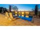 Luxury pool and patio area with lounge chairs and umbrellas at 27648 N 102Nd Ln, Peoria, AZ 85383