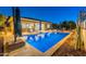 Clean lines and a refreshing pool, creating an oasis in the backyard at 27648 N 102Nd Ln, Peoria, AZ 85383