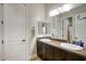 Double vanity bathroom with dark wood cabinets at 280 N 159Th St, Gilbert, AZ 85234