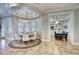 Elegant dining room featuring a round table, chandelier, and built-in seating at 280 N 159Th St, Gilbert, AZ 85234