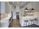 Modern kitchen with white cabinets and island at 280 N 159Th St, Gilbert, AZ 85234