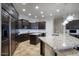 Kitchen with granite countertops and dark wood cabinetry at 280 N 159Th St, Gilbert, AZ 85234