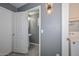 Small bathroom with pedestal sink, gray walls, and tiled floor at 28025 N 23Rd Dr, Phoenix, AZ 85085