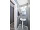 Updated powder room with pedestal sink and gray walls at 28025 N 23Rd Dr, Phoenix, AZ 85085