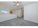 Upstairs bedroom with grey carpet and ceiling fan at 28025 N 23Rd Dr, Phoenix, AZ 85085