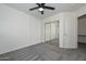 Bedroom with mirrored closet doors and ceiling fan at 28025 N 23Rd Dr, Phoenix, AZ 85085