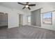 Spacious bedroom with walk-in closet and ceiling fan at 28025 N 23Rd Dr, Phoenix, AZ 85085