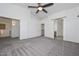 Bright bedroom with ceiling fan and access to bathroom at 28025 N 23Rd Dr, Phoenix, AZ 85085