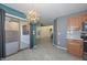 Kitchen with light wood cabinets, grey backsplash and pendant lighting at 28025 N 23Rd Dr, Phoenix, AZ 85085