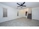 Living room with grey tile floors and staircase at 28025 N 23Rd Dr, Phoenix, AZ 85085