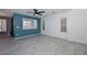 Living room with teal accent wall and tile floors at 28025 N 23Rd Dr, Phoenix, AZ 85085