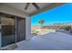 Covered patio with glass sliding doors offering a view of the pool and mountains at 28025 N 23Rd Dr, Phoenix, AZ 85085