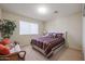 Bedroom with striped bedding, wicker couch and potted plant at 2935 W Kristal Way, Phoenix, AZ 85027