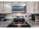 Kitchen with stainless steel stovetop and microwave at 2935 W Kristal Way, Phoenix, AZ 85027