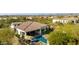 Aerial view of a backyard with pool, patio, and artificial turf at 29615 N 55Th Pl, Cave Creek, AZ 85331