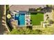 Aerial view of a backyard with a pool, seating, and artificial turf at 29615 N 55Th Pl, Cave Creek, AZ 85331