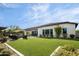 Spacious backyard with artificial turf, covered patio, and outdoor seating area at 29615 N 55Th Pl, Cave Creek, AZ 85331