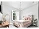 Comfortable bedroom with ample natural light, plush bedding, and stylish decor at 29615 N 55Th Pl, Cave Creek, AZ 85331